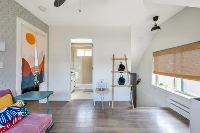 a living room with a couch and a table at Minimal - 90 nights min in Vancouver
