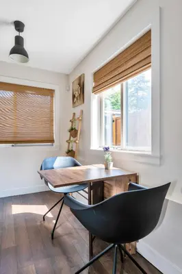 a dining room with a table and chairs at Minimal - 90 nights min in Vancouver