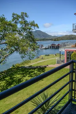 a view of a lake from a balcony at Island Village Properties at Fred Tibbs in Tofino