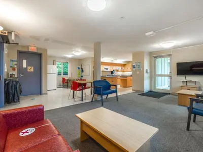 a living room with a couch and a table at Vancouver Island Residences in Nanaimo