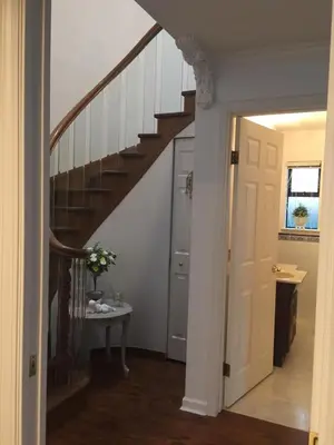 a hallway with a stairway leading to a house at Lee home in Vancouver