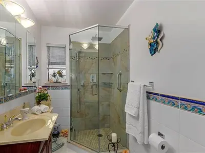 a bathroom with a shower and a sink at Lee home in Vancouver