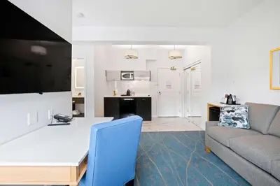 a living room with a couch and a table at Crown Columbia Hotel; BW Premier Collection in Trail