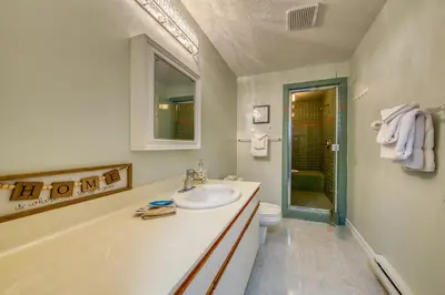 a white bathroom with a sink and a toilet at Marble Canyon in Fairmont Hot Springs