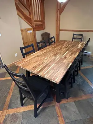 a large wooden table with chairs around it at 3 BR 3 Bath ski in ski out with private hot tub in Big White