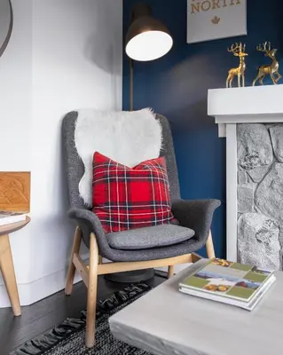 a chair with a red pillow in a living room at THE LOOKOUT PENTHOUSE // a luxe suite in Whistler in Whistler