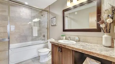 a bathroom with a sink and a toilet and a shower at The Residences at Fairmont Ridge in Fairmont Hot Springs