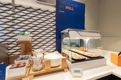 a display case with donuts and other pastries at Wingate by Wyndham Fort Saskatchewan in Fort Saskatchewan