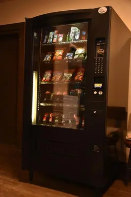 a vending machine with food inside of it at PARTY HOSTEL - The Canmore Hotel Hostel in Canmore