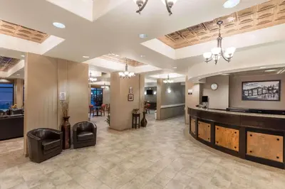 a lobby with a salon with a waiting room at Super 8 by Wyndham Edson in Edson