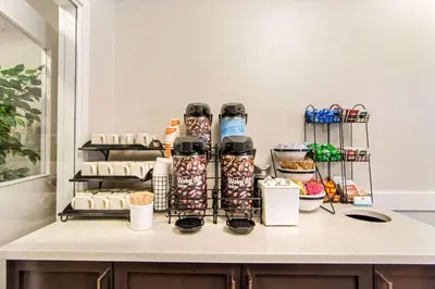 a counter with food and drinks on it at Comfort Inn & Suites in Red Deer