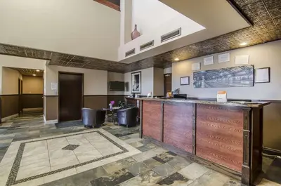 a lobby of a hospital with a reception desk at Econo Lodge Lloydminster in Lloydminster
