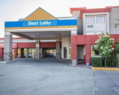 a hotel lobby with a sign on top of it at Quality Inn & Conference Centre in Red Deer