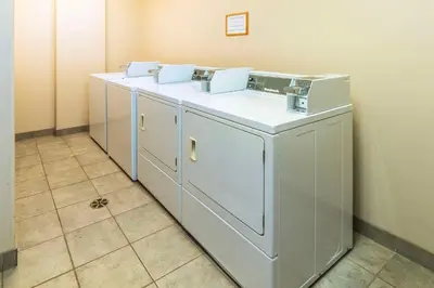 a row of white cabinets in a room at Comfort Inn & Suites in Salmon Arm