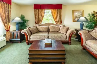 a living room with a couch and a coffee table at Comfort Inn & Suites in Salmon Arm