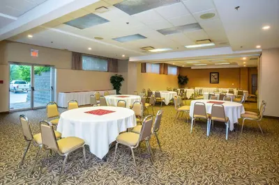 a conference room with tables and chairs in it at Comfort Inn & Suites in Salmon Arm