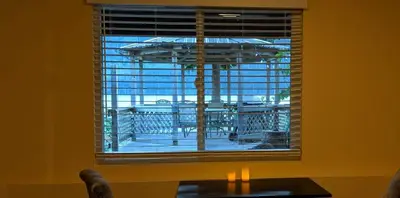 a window in a room with a table in front at Frigon Suite -Waterfront in Port Alice