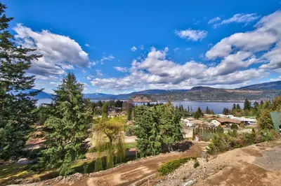 a view of a town with a lake and mountains at Semi-Lakefront Luxury Retreat In Blind Bay, Bc Cottage in Blind Bay