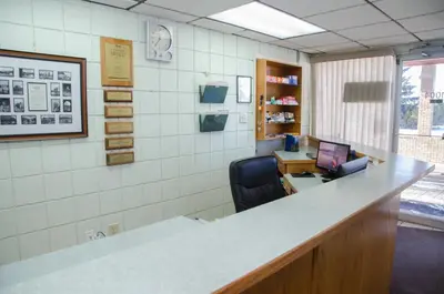 an office with a desk with a computer and a chair at Plains Motel in Brooks