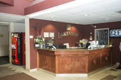 a restaurant with a cash counter in a store at Lakeview Inns & Suites - Chetwynd in Chetwynd