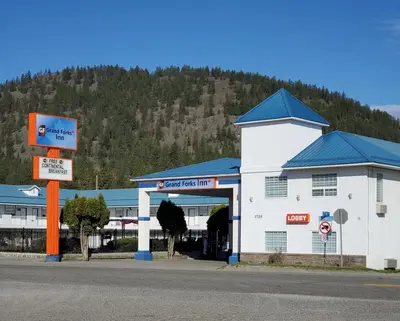 a gas station on the side of a road at Grand Forks Inn in Grand Forks