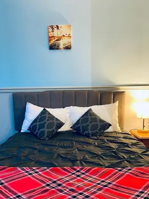 a bed with two pillows on top of it at Elite Hotel -Downtown Center- 