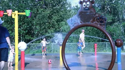a group of children playing in a water park at Elite Hotel -Downtown Center- 