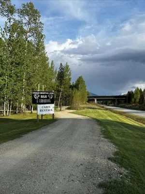 a sign on the side of a road at Cougar Mountain Lodge and Resort Cabin Rentals in Valemount