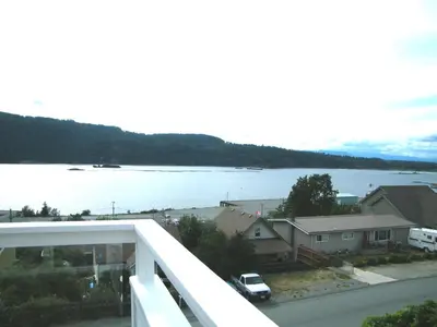 a view of the water from a balcony of a house at Outdoor Lovers in Port Alberni