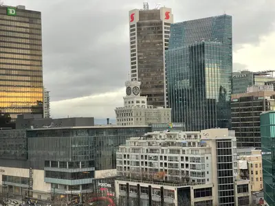 a city skyline with a clock tower and buildings at Vancouver Downtown Central 1 bedroom Condo in Vancouver