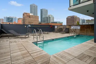a swimming pool on the roof of a building at GlobalStay Modern Condos Downtown Calgary in Calgary