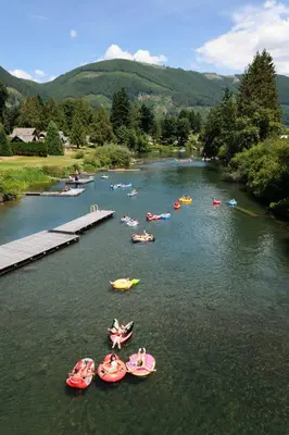 a group of people in boats on a river at Valley View in Lake Cowichan