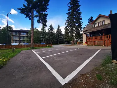 a parking lot in front of a building at Riverfront Estate Bed&Breakfast Banff in Banff