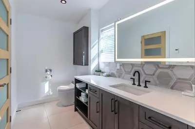 a bathroom with a sink and a mirror at Halcyon Hot Springs Resort in Halcyon Hot Springs