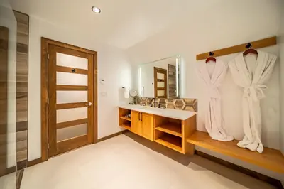 a bathroom with a sink and a mirror at Halcyon Hot Springs Resort in Halcyon Hot Springs