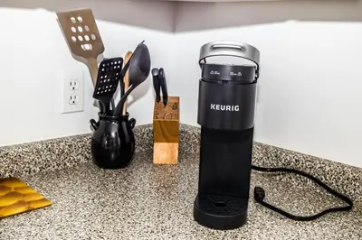 a rechargeable blender sitting on a kitchen counter at Crescent Motel in Radium Hot Springs