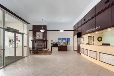 a large room with a kitchen and a living room at Best Western High Road Inn in Edson