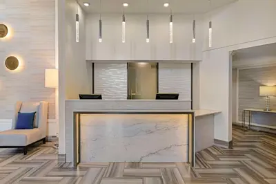 a lobby with a marble counter and a chair at Best Western Northgate in Nanaimo