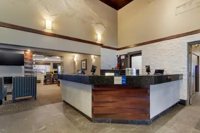 a lobby with a bar in a hotel at Best Western PLUS City Centre Inn in Edmonton