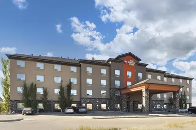 a rendering of a hotel building with a parking lot at Best Western Plus Sherwood Park in Sherwood Park