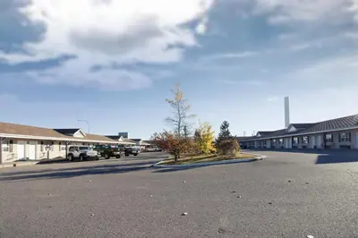 a parking lot in front of a building at Bow River Inn in Cochrane