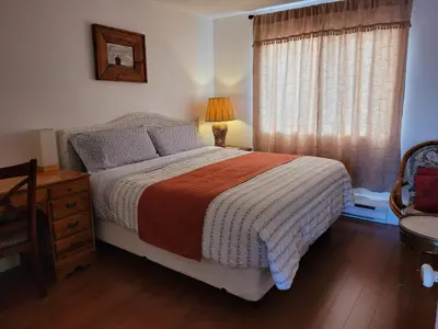 a bedroom with a bed and a window at Croft Inn Motel in Crofton