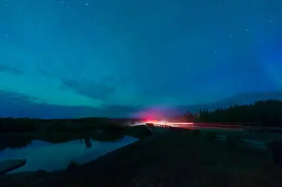 a night view of a bridge with a red light at Nova Inn Yellowknife in Yellowknife