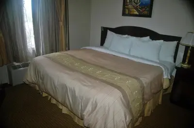 a large bed in a hotel room at Days Inn by Wyndham Athabasca in Athabasca