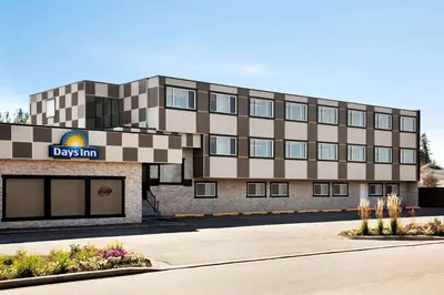 a rendering of a building with a davis inn at Days Inn by Wyndham Sylvan Lake in Sylvan Lake