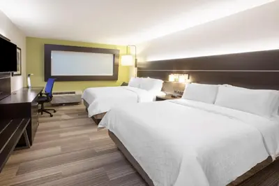 a hotel room with two beds and a flat screen tv at Holiday Inn Express & Suites - North Battleford by IHG in North Battleford