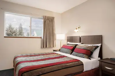 a bedroom with a large bed with a window at Travelodge by Wyndham McBride in McBride