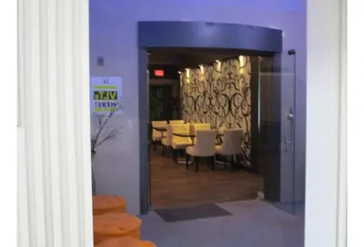 a view of a dining room with tables and chairs at Motel 6 Kerrobert, SK in Kerrobert