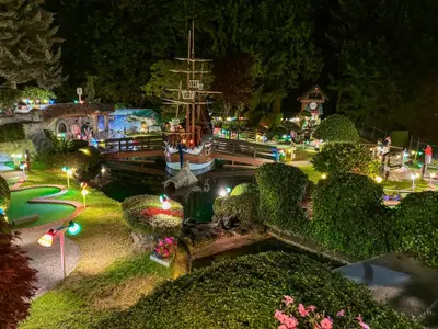 a model of a boat in a garden at night at The Tide's Inn in Parksville