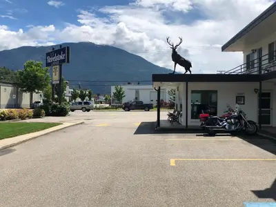 a statue of a deer on the roof of a building at Revelstoke Lodge in Revelstoke
